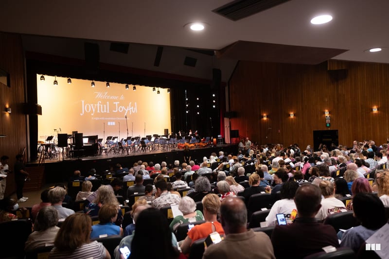 A large audience fills the auditorium during a Joyful Joyful concert featuring the Australian Christian Orchestra.
